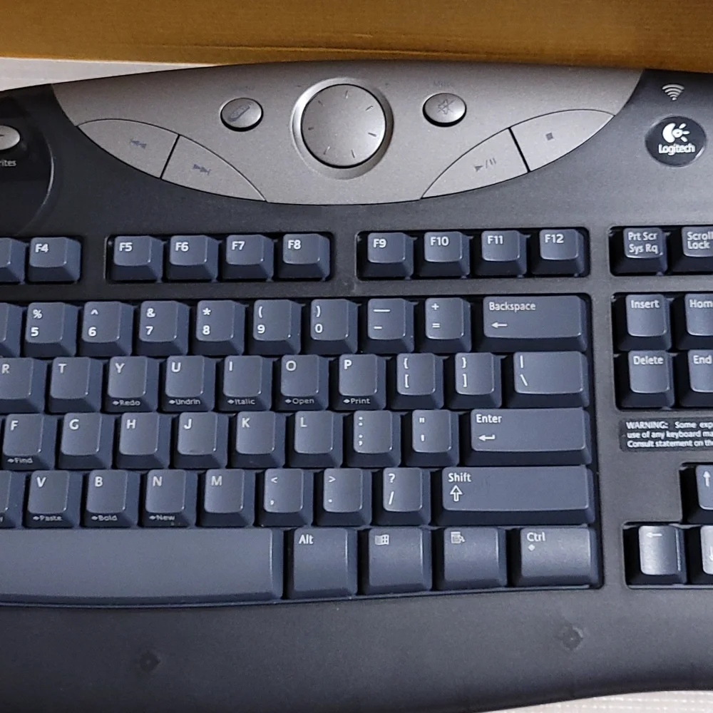 Logitech cordless freedom optical - cordless keyboard and optical mouse